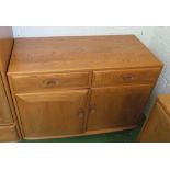 An Ercol Golden Dawn small sideboard two drawers and two cupboards