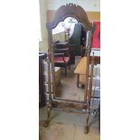 A figured walnut cheval mirror