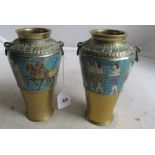 A pair of Egyptian revival brass vases decorated bands of figures