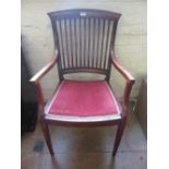 A slat back Edwardian chair