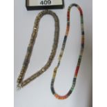 A silver necklace and a necklace made up of different coloured opal circles