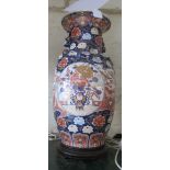 A blue ground oriental vase with reserves of flowers and birds gilt detail, converted to a lamp (