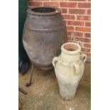 A pottery vase and another on stand