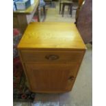 A pair of Ercol Golden Dawn single door cabinets