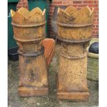 A pair of crown topped chimney pots