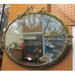 A brass bevel edge mirror