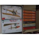 Two boxes of model planes