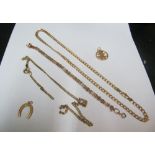 A 9ct gold chain 13g, chain marked 9kt, gate link bracelet, 9ct horseshoe charm and a Chinese