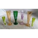 Two small green Mary Gregory flute spill vases and four other flute vases