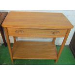 An Ercol Golden Dawn side table with drawer and undertier