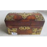 A Victorian walnut dome top tea caddy with brass mounts