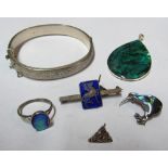 A mother of pearl kiwi brooch, silver filled bracelet and a small group of other jewellery