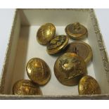 A small group of military buttons