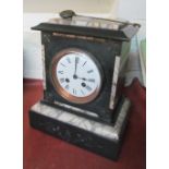 A Victorian marble and black slate mantel clock