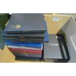 A collection of Royal Mint cased presentation 'UK Proof Collections' (thirteen sets) and a 2013