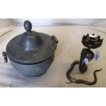 A bronze snake candleholder and a metal lidded pot