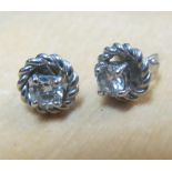 A pair of diamond set stud earrings