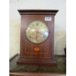 An Edwardian mahogany clock