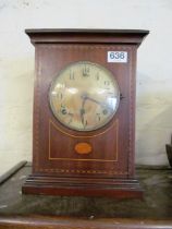 An Edwardian mahogany clock