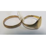 A 9ct gold signet ring 2.1g and a metal core ring