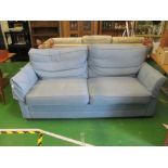 A blue three seater settee
