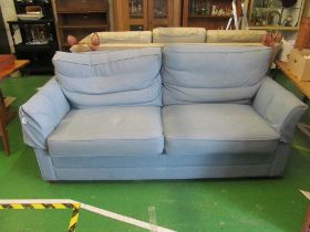 A blue three seater settee