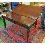 A flame mahogany extending dining table on square tapered legs, four leaves 92" extended by 47 1/2",