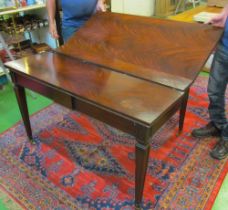 A flame mahogany extending dining table on square tapered legs, four leaves 92" extended by 47 1/2",