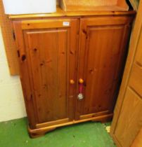 A Ducal pine two door cabinet