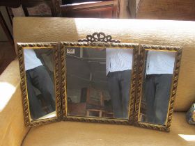 A gilt framed triple dressing table mirror