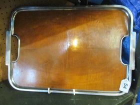 A 1930's walnut tray with chrome edge