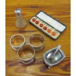 Three silver napkin rings, salt, pepper and a set of studs