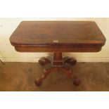 A Regency rosewood card table on tapered column and platform base