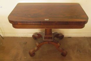 A Regency rosewood card table on tapered column and platform base