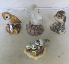 A Royal Crown Derby Barn Owl, another owl, Blue Tit group and a pigeon (all boxed)