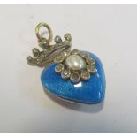 A yellow metal blue enamel heart shaped pendant with crown top set seed pearls and rose diamonds