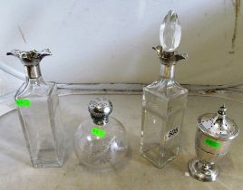 A silver top scent bottle, castor and pair of tall decanters (one no stopper)