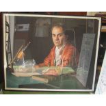 A large photographic historic portrait of a man sitting at a desk with microscope signed
