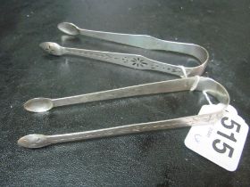 A pair of Georgian silver sugar tongs and another 1.8 ozs