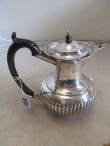 A silver coffee pot