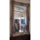 A large gilt mirror plastic frame