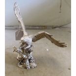 A hallmarked silver resin filled eagle on stand (wing repaired)