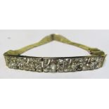 An 18ct gold mesh bracelet with five flexible diamond sections (one stone missing) 15.2g