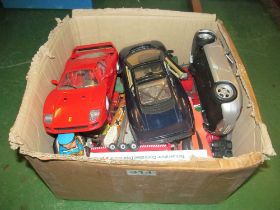 Three model cars and other cars