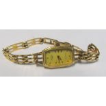 A 9ct gold ladies watch and strap