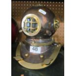 A copper and brass small diver's helmet