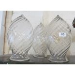 A set of three swirl pattern large glass shades