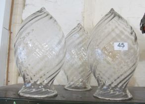 A set of three swirl pattern large glass shades