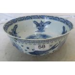 An oriental blue and white fish bowl (rivet repair and chips to rim)