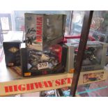 A Highway set and some cars/motorcycles and tin Duck on Bike